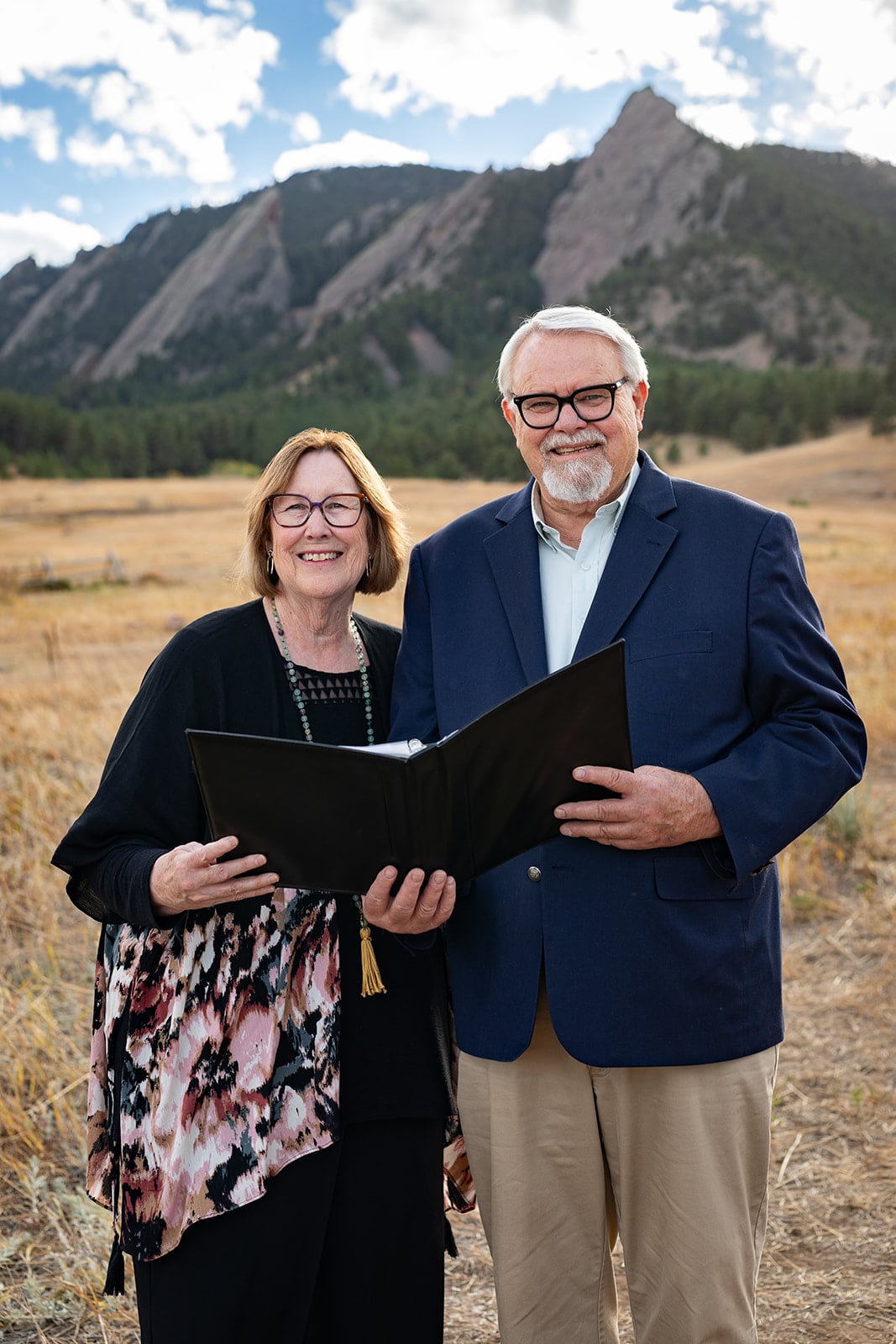 Benjamin and Teri Martin holding an open ceremony folder